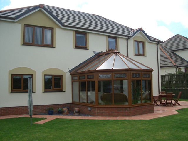 House with a cherrywood Victorian conservatory fitted by Gardinia