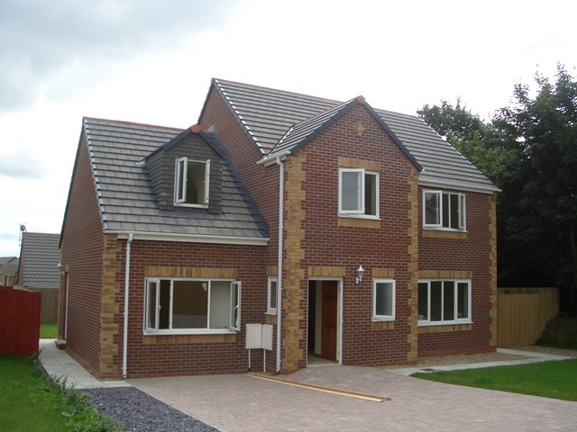 New build home with white PVCu windows and door